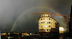 Big rainbow in storm light, outside my house

