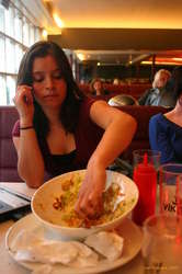 Ellen rummages in the nachos
