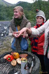 Liza, Sarah and Nicky watch dinner get cooked
