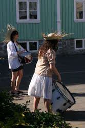 With funny hats and big drums...
