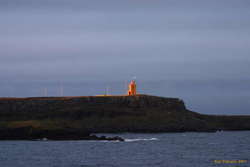 Last sun on Raufahöfn lighthouse

