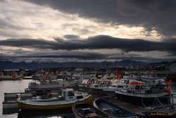 Húsavík harbour under threatening weather
