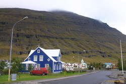 The town is tucked under the mountains
