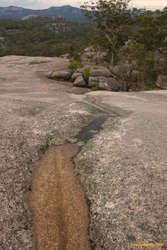 Follow the water downhill
