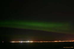 Aurora over Seltjarnarnes and Reykjavik, from Álftanes
