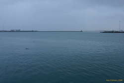 Calm sea under rain
