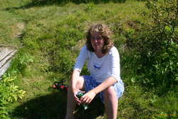 Sunburnt Unnur sitting in the creek
