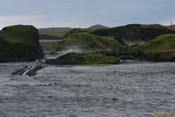 Well over the road, nearly to the bridge
