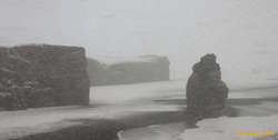 Arnardrangur standing tall on the beach
