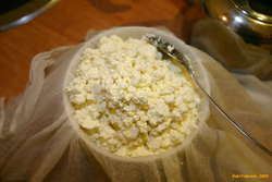 Packing a cheese mould
