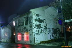 Christmas lights on a house needing work
