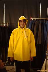 Trying on raincoats
