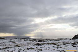 A window in the weather coming across the lake

