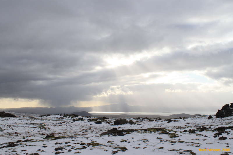 A window in the weather coming across the lake
